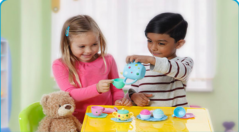 two kids having a tea party